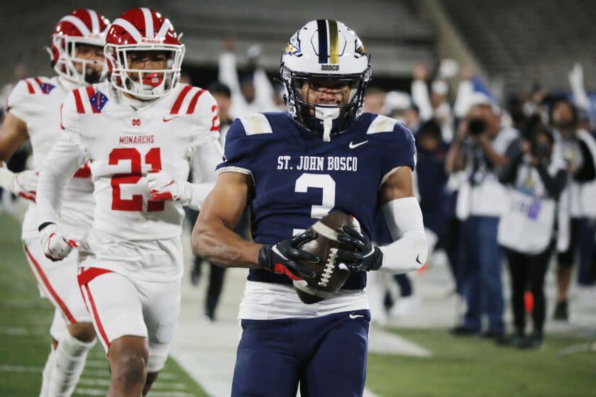 PASADENA, CALIF. - NOV. 25, 2022, St. John Bosco wide receiver DeAndre Moore runs untouched for a touchdown against Mater Dei in the third quarter of the CIF Southern Section Championship Game at the Rose Bowl in Pasadena on Friday night, Nov. 25, 2022. Bosco won, 24-22. (Luis Sinco / Los Angeles Times)