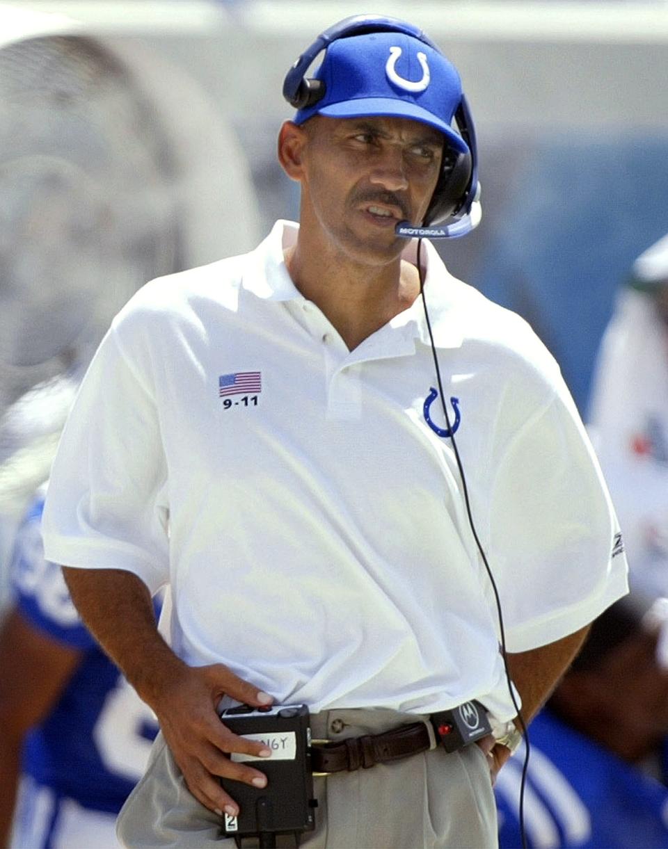 Indianapolis Colts head coach Tony Dungy talks to his coaches on his radio against the Jacksonville Jaguars, Sunday, Sept. 8, 2002, in Jacksonville, Fla. Dungy, in his first regular-season game as Colts head coach, got a win as his team defeated the Jaguars 28-25.