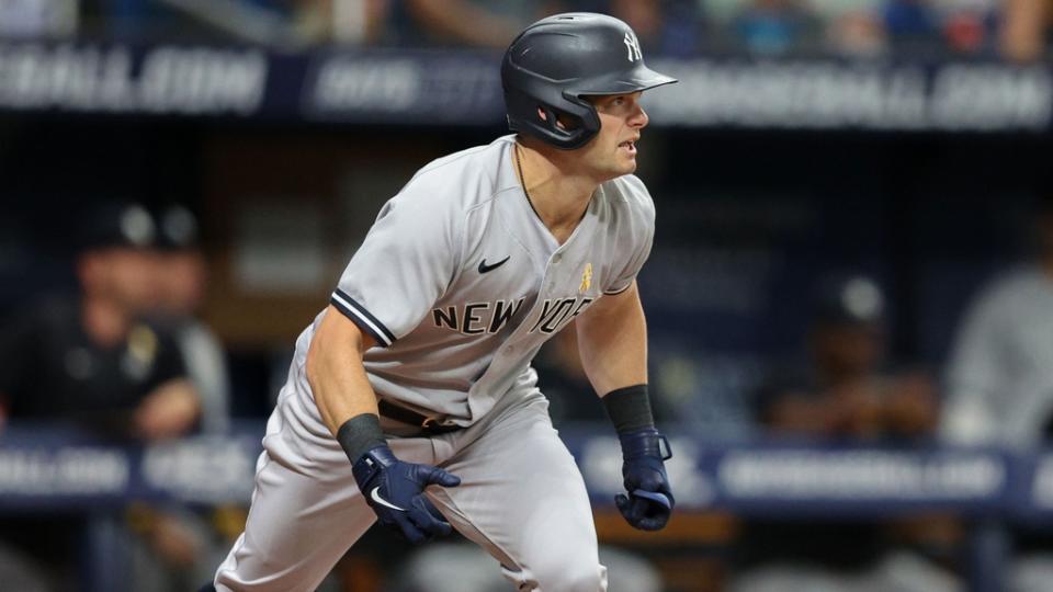 Sep 2, 2022; St. Petersburg, Florida, USA; New York Yankees left fielder Andrew Benintendi (18) doubles against the Tampa Bay Rays in the first inning at Tropicana Field.