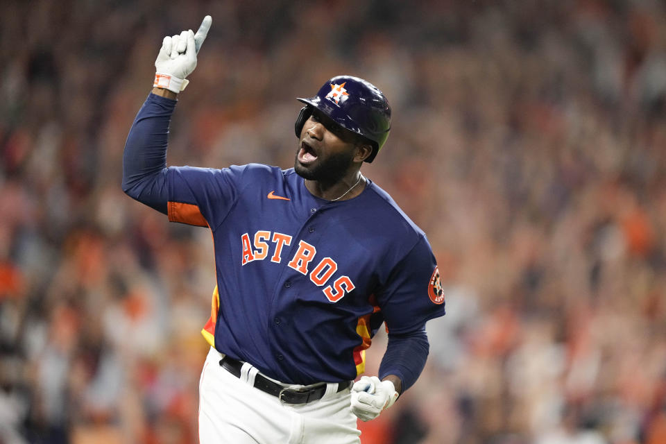 Yordan Alvarez celebrates his three-run home run during the sixth inning of Game 6 of the World Series. (AP Photo/David J. Phillip)