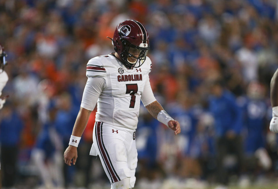 South Carolina quarterback Spencer Rattler (7) walks off the filed against Florida, Saturday, Nov. 12, 2022, in Gainesville, Fla. (AP Photo/Matt Stamey)