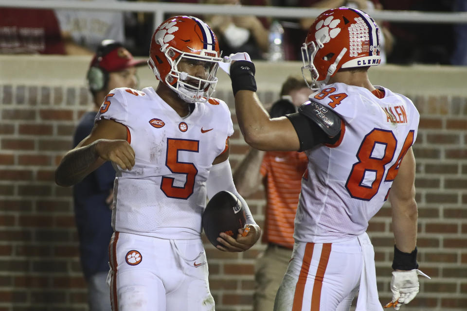 Clemson quarterback DJ Uiagalelei (5) celebrates his touchdown with tight end Davis Allen (84) during the second quarter of the team's NCAA college football game against Florida State on Saturday, Oct. 15, 2022, in Tallahassee, Fla. (AP Photo/Phil Sears)