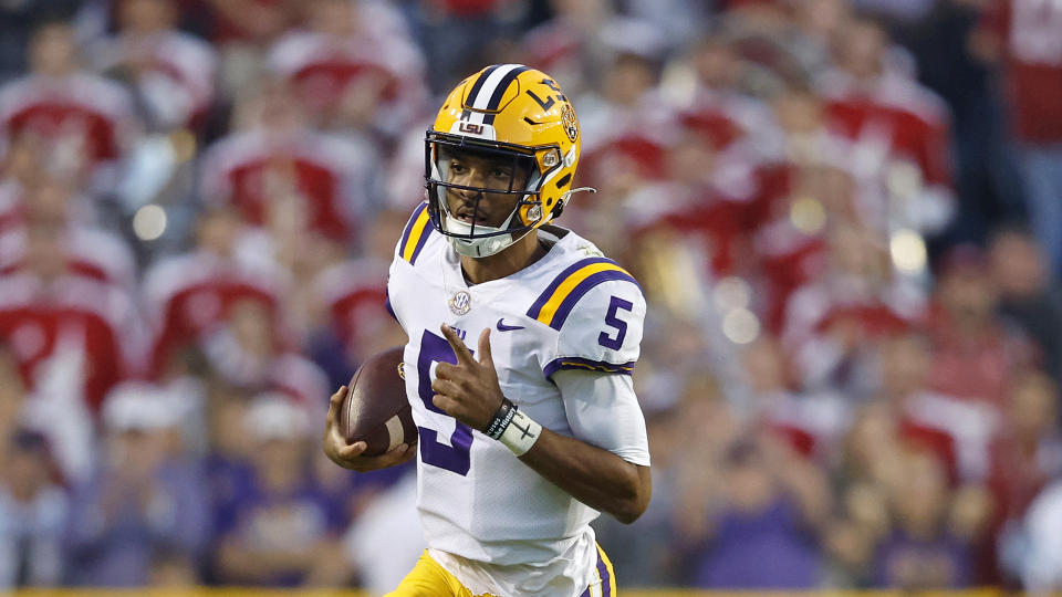 LSU quarterback Jayden Daniels (5) runs the ball during the first half of an NCAA college football game against Alabama in Baton Rouge, La., Saturday, Nov. 5, 2022. (AP Photo/Tyler Kaufman)