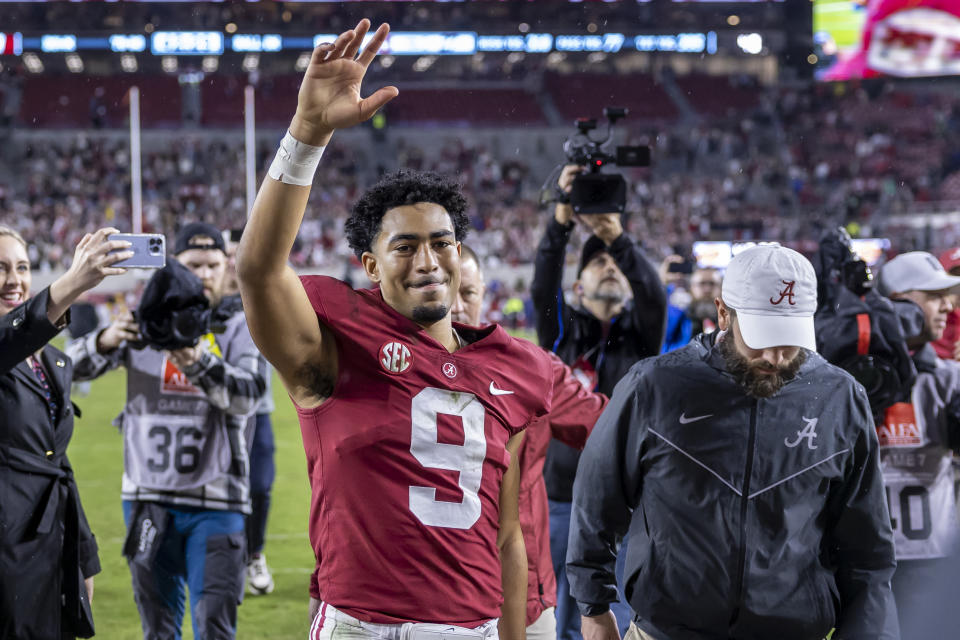 Alabama quarterback Bryce Young (9) salutes the fans as he leaves the field following a win over Auburn on Saturday, Nov. 26, 2022, in Tuscaloosa, Ala. (AP Photo/Vasha Hunt)