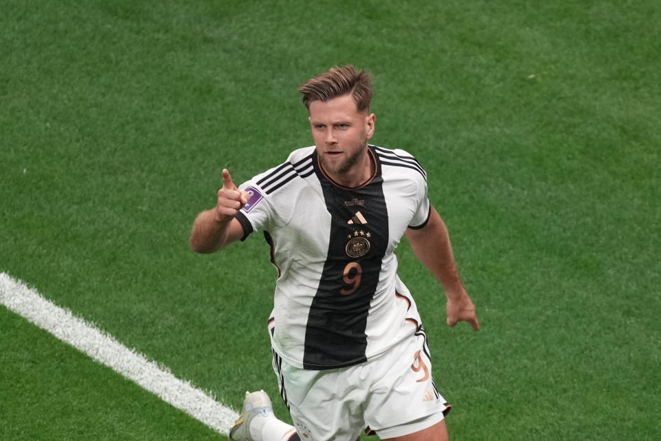 AL KHOR, QATAR - NOVEMBER 27: Niclas Fullkrug (9) of Germany celebrates with his teammates after scoring a goal during the FIFA World Cup Qatar 2022 Group E match between Spain and Germany at Al Bayt Stadium on November 27, 2022 in Al Khor, Qatar. (Photo by Ercin Erturk/Anadolu Agency via Getty Images)