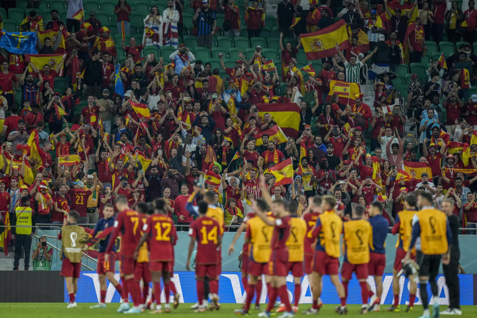 Spain's players celebrate their team victory at the end of the World Cup group E soccer match between Spain and Costa Rica, at the Al Thumama Stadium in Doha, Qatar, Wednesday, Nov. 23, 2022. (AP Photo/Francisco Seco)