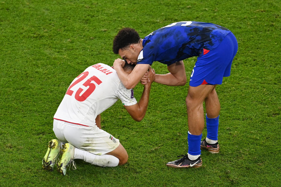 Antonee Robinson was one of the American players to console his opponent after their World Cup match with Iran. (Photo by Claudio Villa/Getty Images)