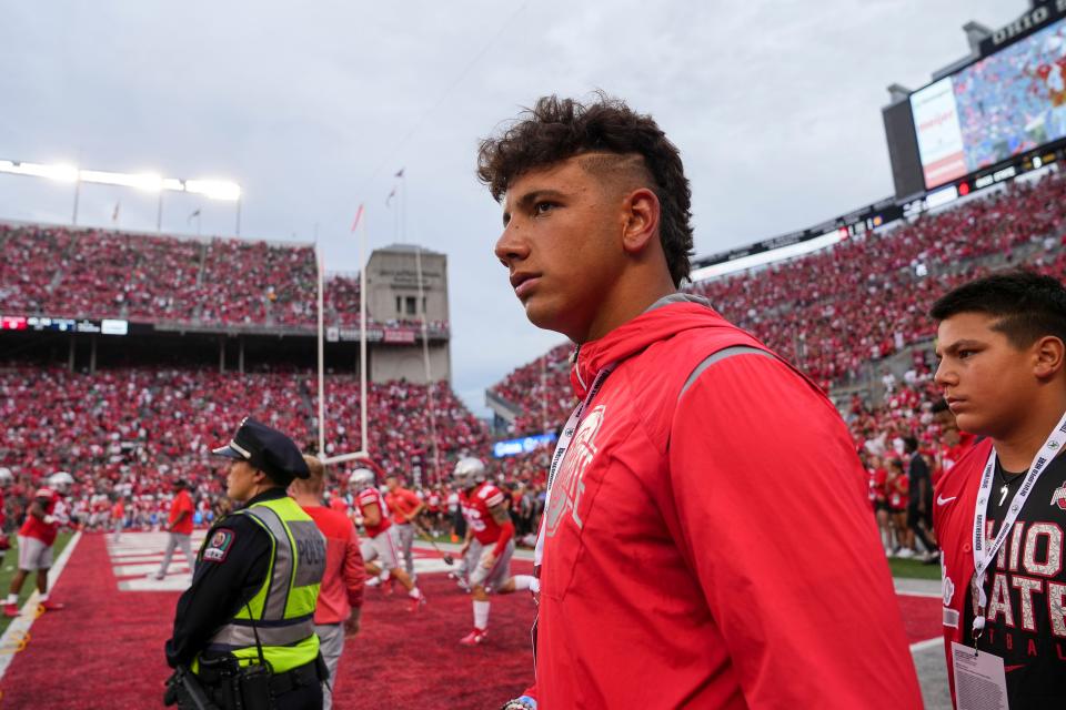 Sep 3, 2022; Columbus, Ohio, USA; Quarterback recruit Dylan Raiola walks the sideline prior to the NCAA football game between the Ohio State Buckeyes and Notre Dame Fighting Irish at Ohio Stadium. Mandatory Credit: Adam Cairns-USA TODAY Sports