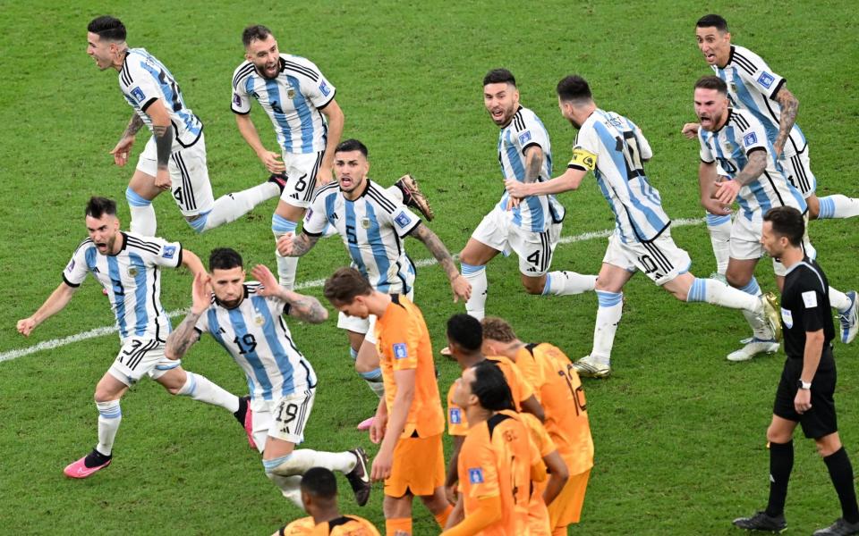 Nicolas Otamendi cups his ears in front of the dejected Dutch players - Anadolu Agency/Getty Images