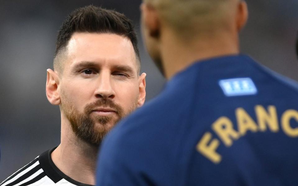  Kylian Mbappe of France embraces Lionel Messi - FIFA via Getty Images)