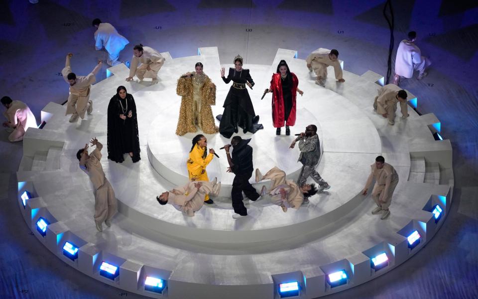 Artists perform during the tournament closing ceremony prior to the World Cup final soccer match between Argentina and France at the Lusail Stadium - Thanassis Stavrakis/AP