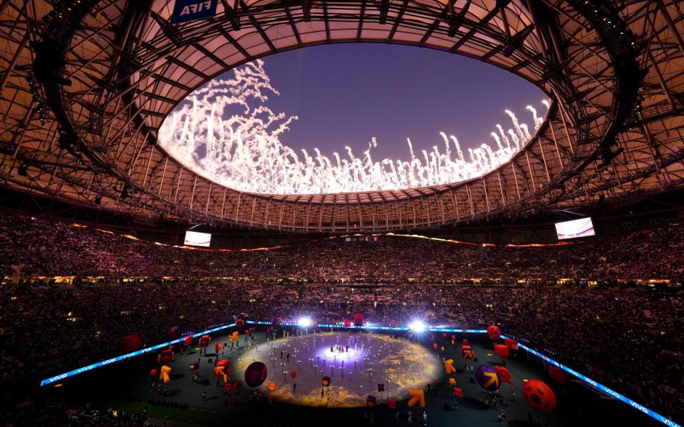 Fireworks explode as artists perform during the World Cup closing ceremony before the final soccer match between Argentina and France at the Lusail Stadium - AP/Hassan Ammar