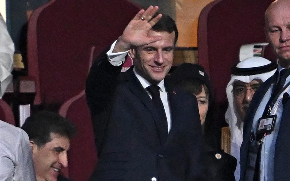 French President Emmanuel Macron (C) waves ahead of the start of the Qatar 2022 World Cup final football match between Argentina and France at Lusail Stadium in Lusail, north of Doha - Getty Images/Paul Ellis