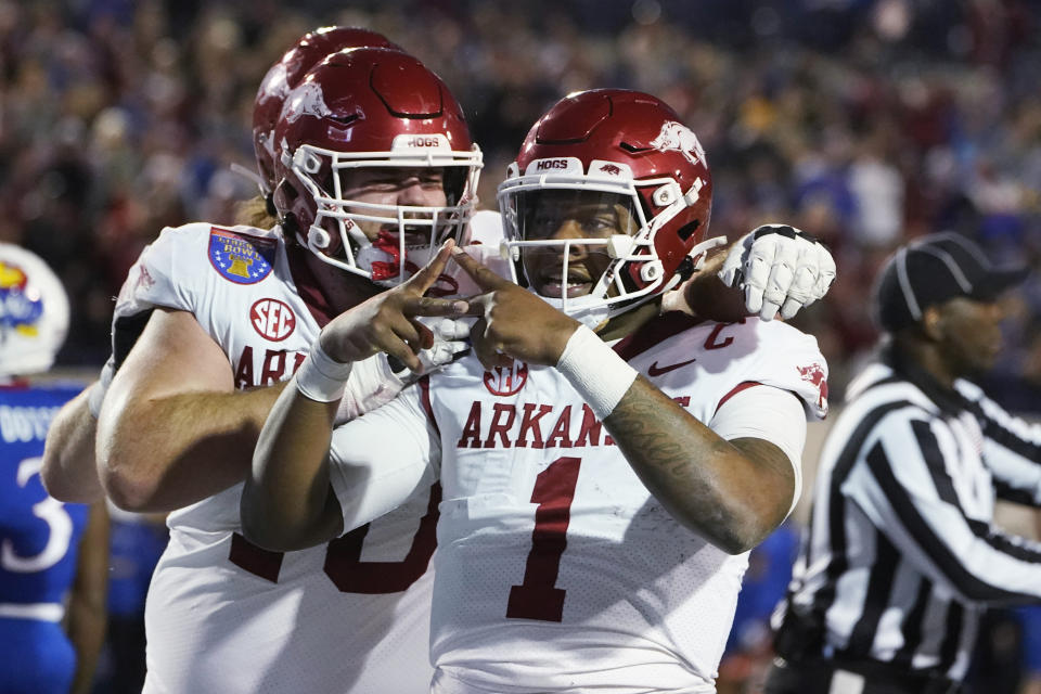 Arkansas quarterback KJ Jefferson (1) gestures toward fans after scoring a touchdown against Kansas during the first half of the Liberty Bowl NCAA college football game Wednesday, Dec. 28, 2022, in Memphis, Tenn. (AP Photo/Rogelio V. Solis)