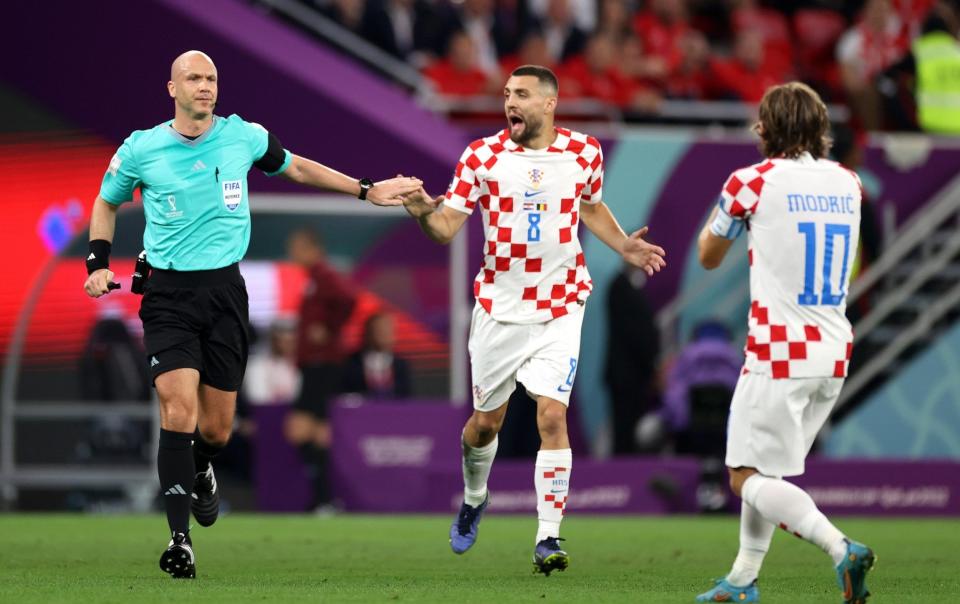 Referee Anthony Taylor speaks to Mateo Kovacic and Luka Modric - Michael Steele/Getty Images