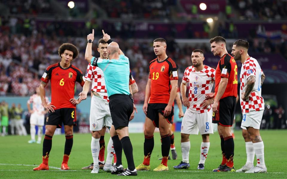 Referee Anthony Taylor checks the VAR screen before ruling out a penalty - Michael Steele/Getty Images