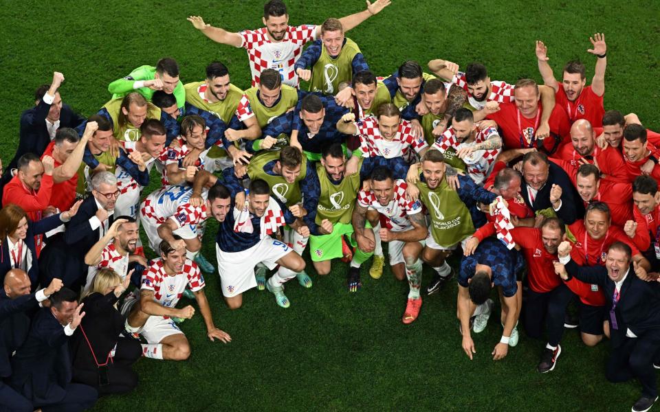 Croatia's players and team members celebrate at the end of the Qatar 2022 World Cup - AFP