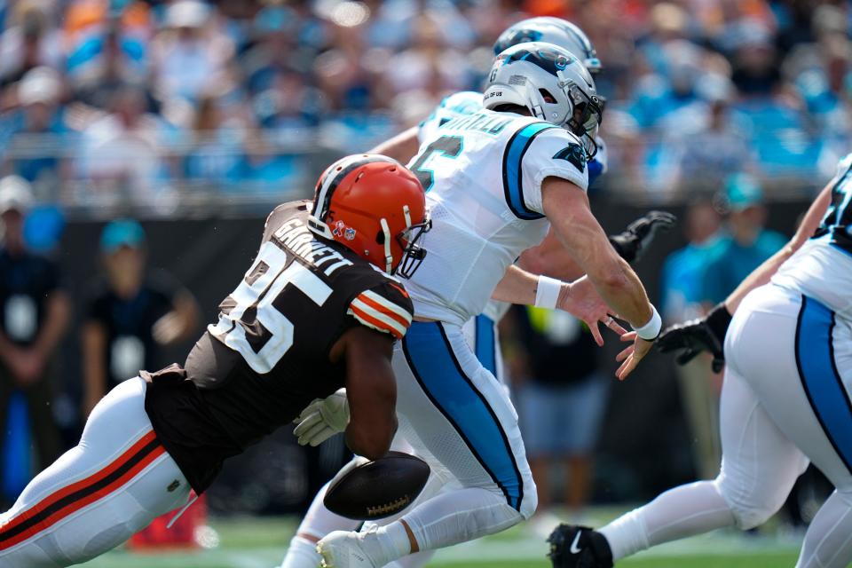 Carolina Panthers quarterback Baker Mayfield is sacked by Cleveland Browns defensive end Myles Garrett during the second half of an NFL football game on Sunday, Sept. 11, 2022, in Charlotte, N.C. (AP Photo/Rusty Jones)