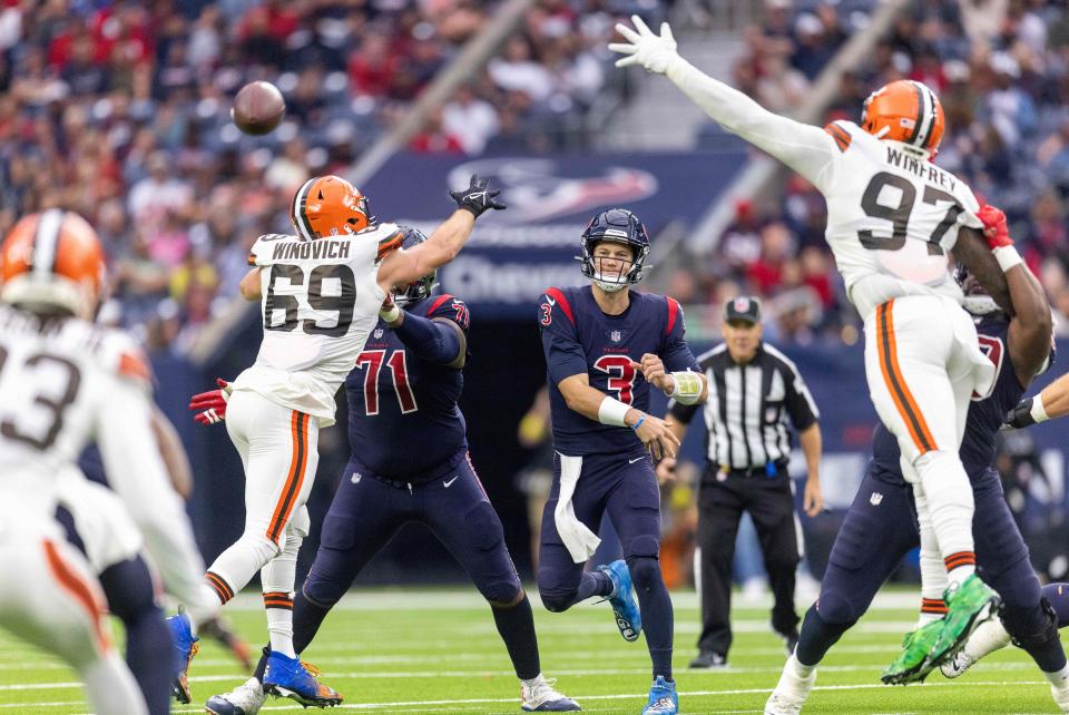 Dec 4, 2022; Houston, Texas, USA; Houston Texans quarterback Kyle Allen (3) passes against Cleveland Browns defensive end Chase Winovich (69) and defensive tackle Perrion Winfrey (97) in the second quarter at NRG Stadium. Mandatory Credit: Thomas Shea-USA TODAY Sports