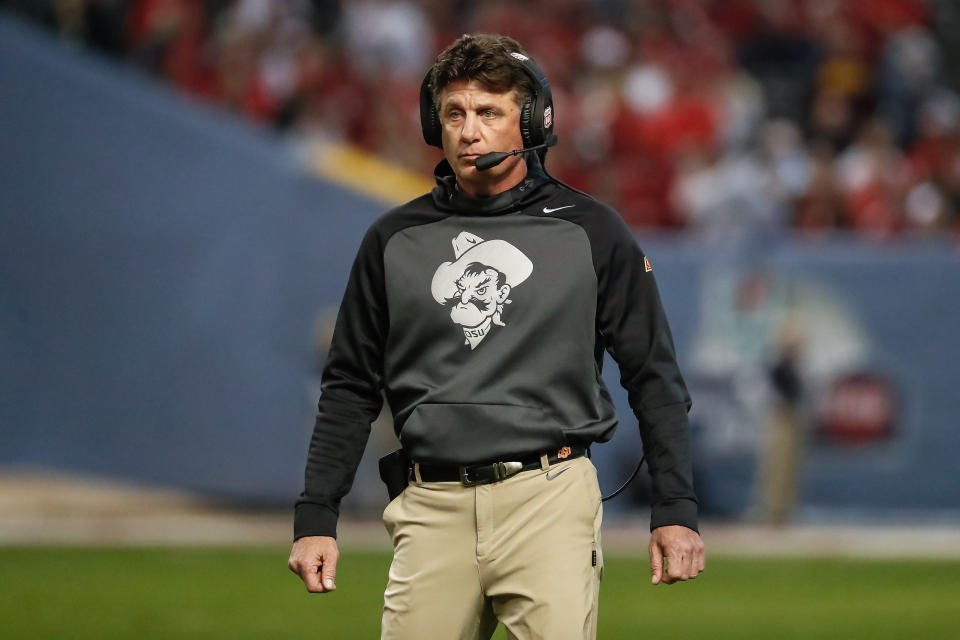 PHOENIX, AZ - DECEMBER 27: Oklahoma State Cowboys head coach Mike Gundy looks on during the college football Guaranteed Rate Bowl game between the Wisconsin Badgers and the Oklahoma State Cowboys on December 27, 2022 at Chase Field in Phoenix, Arizona. (Photo by Kevin Abele/Icon Sportswire via Getty Images)