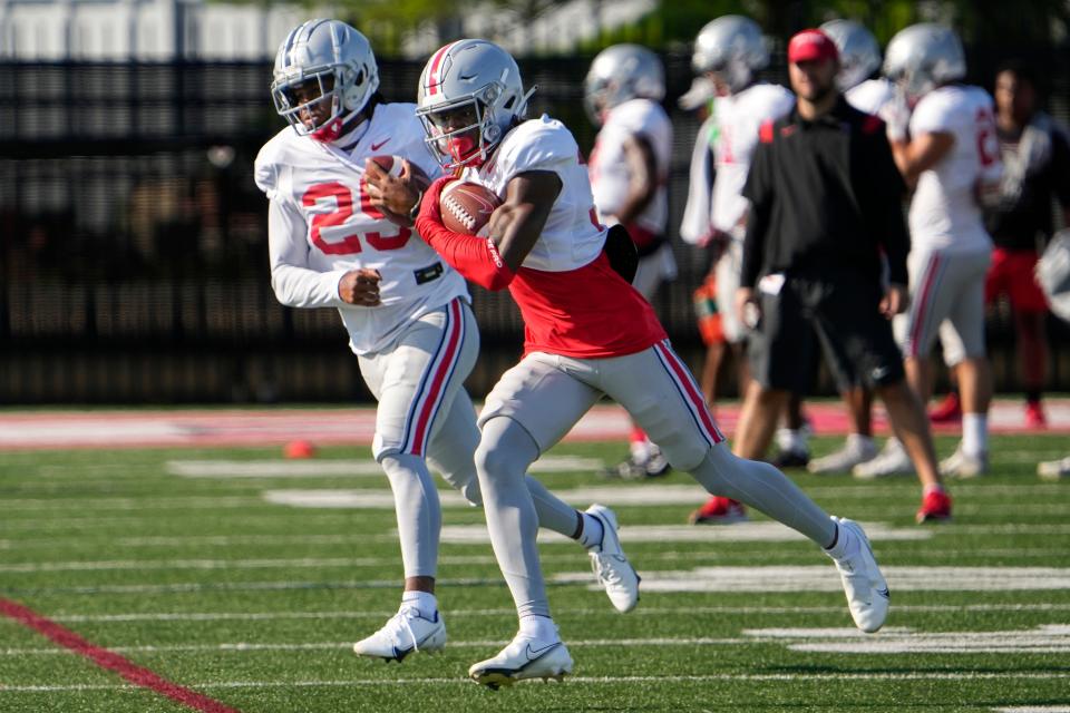 Aug 11, 2022; Columbus, OH, USA; Ohio State Buckeyes safeties Kye Stokes (37) and Jaylen Johnson (25) catch passes during football camp at the Woody Hayes Athletic Center. Mandatory Credit: Adam Cairns-The Columbus Dispatch