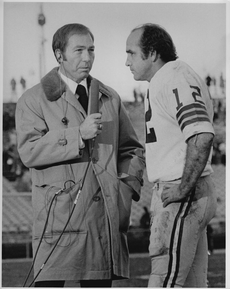 Former Green Bay Packers quarterback Bart Starr, then a television commentator, interviews Packers quarterback John Hadl.