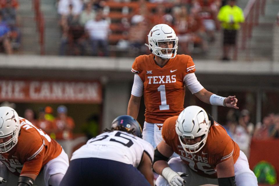 Texas quarterback Hudson Card directs the offense during a game against West Virginia on Oct. 1, 2022.