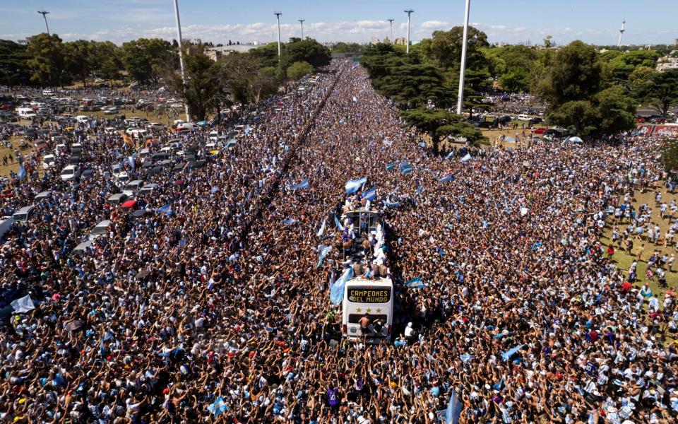 The Argentine soccer team that won the World Cup title ride on an open bus during their homecoming parade in Buenos Aires, Argentina - AP