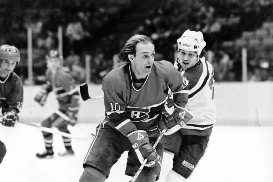 FILE - Guy Lafleur (10) of the Montreal Canadiens cuts in front of Aaron Broten of the New Jersey Devils during third period NHL action at the Meadowlands Arena in East Rutherford, N.J., Dec. 20, 1983. Lafleur scored his 500th career goal as Montreal beat the Devils 6-0. Hockey Hall of Famer Guy Lafleur, who helped the Montreal Canadiens win five Stanley Cup titles in the 1970s, died Friday, April 22, 2022, at age 70. (AP Photo/Bill Kostroun, File)