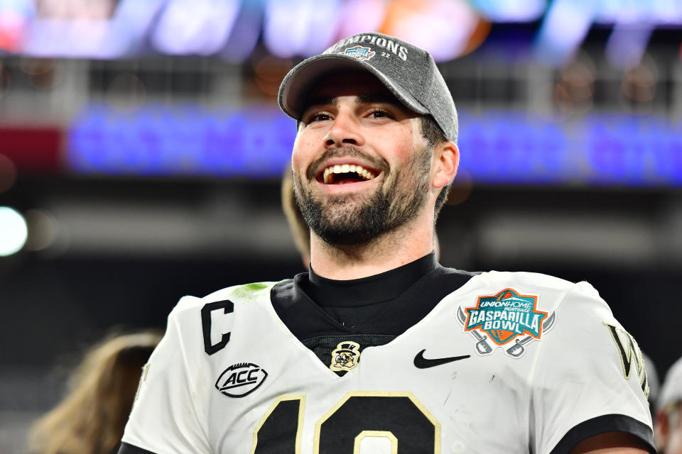 TAMPA, FLORIDA - DECEMBER 23: Sam Hartman #10 of the Wake Forest Demon Deacons reacts after defeating the Missouri Tigers 27-17 to win the Union Home Mortgage Gasparilla Bowl at Raymond James Stadium on December 23, 2022 in Tampa, Florida. (Photo by Julio Aguilar/Getty Images)