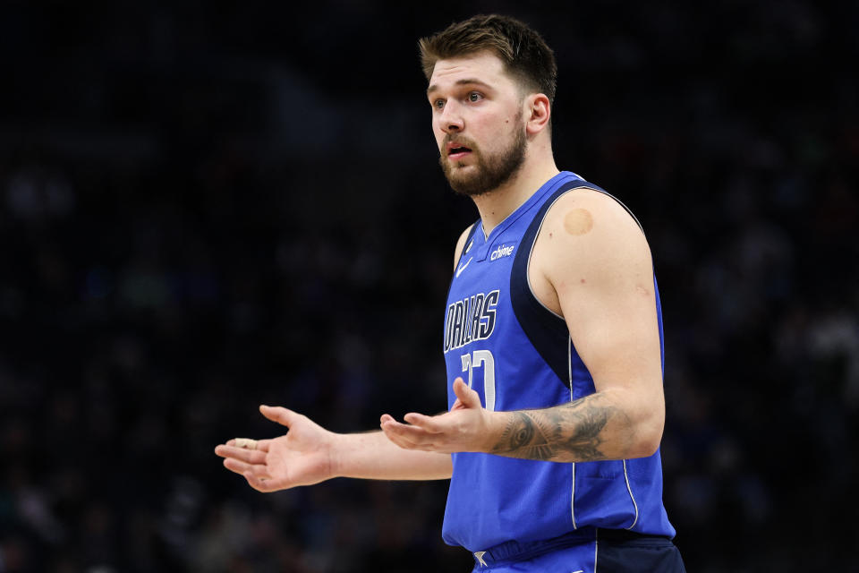 Dec 19, 2022; Minneapolis, Minnesota, USA; Dallas Mavericks guard Luka Doncic (77) reacts after being ejected from the game during the third quarter against the Minnesota Timberwolves at Target Center. Mandatory Credit: Matt Krohn-USA TODAY Sports