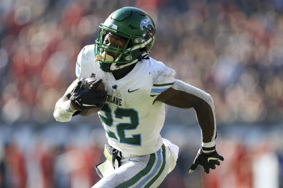 Tulane running back Tyjae Spears (22) carries the ball for a touchdown during an NCAA college football game against Cincinnati, Friday, Nov. 25, 2022, in Cincinnati. Tulane won 27-24. (AP Photo/Aaron Doster)