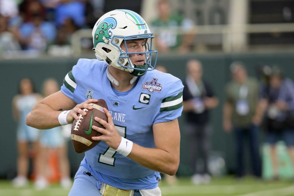 Tulane quarterback Michael Pratt (7) drops back to throw against Central Florida during the first half of the American Athletic Conference championship NCAA college football game in New Orleans, Saturday, Dec. 3, 2022. (AP Photo/Matthew Hinton)