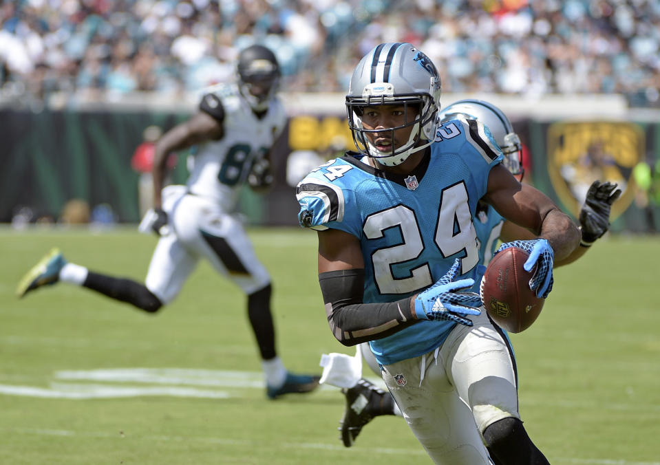 FILE - Carolina Panthers cornerback Josh Norman (24) runs back an interception against the Jacksonville Jaguars for a 30-yard touchdown during the second half of an NFL football game on Sept. 13, 2015, in Jacksonville, Fla. The Panthers worked out 35-year-old cornerback Norman on Monday, Dec. 26, 2022, because starter Jaycee Horn’s status for Sunday’s crucial game against the Tampa Bay Buccaneers is up in the air. (AP Photo/Phelan M. Ebenhack, File)