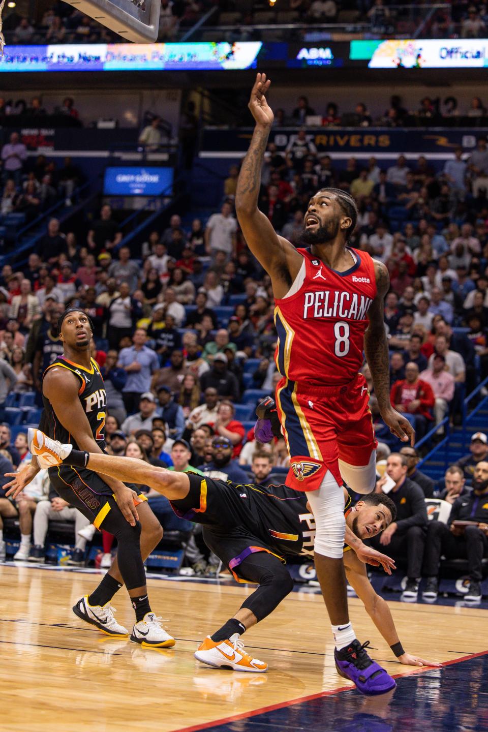 Dec 9, 2022; New Orleans, Louisiana, USA; Phoenix Suns guard Devin Booker (1) fouls New Orleans Pelicans forward Naji Marshall (8) during the first half at Smoothie King Center. Mandatory Credit: Stephen Lew-USA TODAY Sports