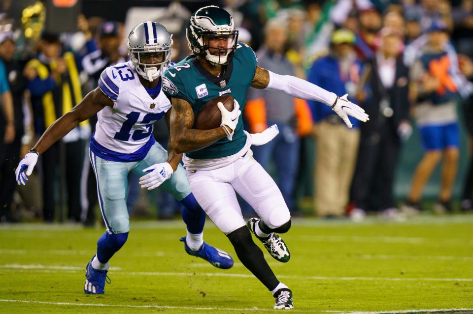 Philadelphia Eagles cornerback Darius Slay (2) with the interception as Dallas Cowboys wide receiver Michael Gallup (13) tried to chase him down during the NFL football game, Sunday, Oct. 16, 2022, in Philadelphia.