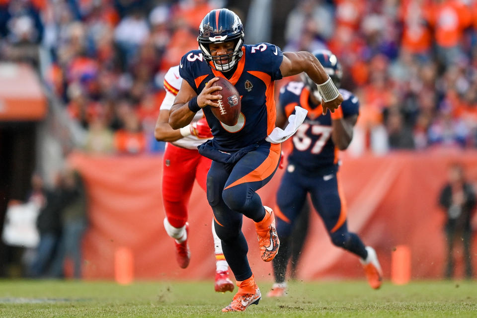 DENVER, CO - DECEMBER 11: Denver Broncos quarterback Russell Wilson (3) rushes for a 19-yard gain and first down in the second quarter during a game between the Kansas City Chiefs and the Denver Broncos at Empower Field at Mile High on December 11, 2022 in Denver, Colorado. (Photo by Dustin Bradford/Icon Sportswire via Getty Images)