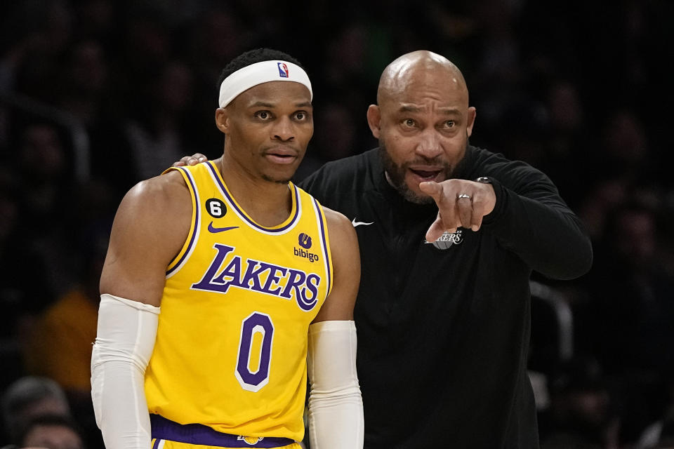 Lakers head coach Darvin Ham, right, talks with guard Russell Westbrook during a game against the Portland Trail Blazers on Nov. 30 in Los Angeles. (AP Photo/Mark J. Terrill)