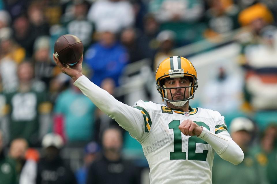 Green Bay Packers quarterback Aaron Rodgers (12) passes during the first half of an NFL football game against the Miami Dolphins, Sunday, Dec. 25, 2022, in Miami Gardens, Fla. (AP Photo/Jim Rassol)