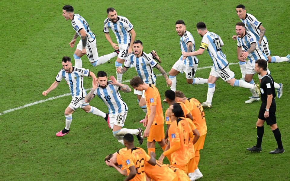 Nicolas Otamendi cups his ears in front of the dejected Dutch players - Anadolu Agency/Getty Images