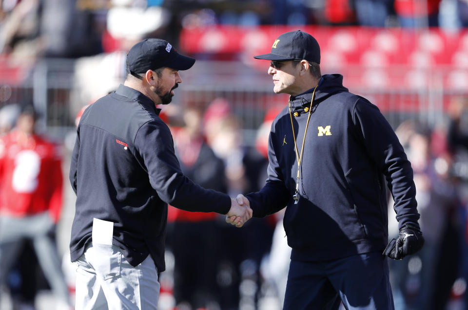 Nov 26, 2022; Columbus, Ohio, USA; Michigan Wolverines head coach Jim Harbaugh (right) and Ohio State Buckeyes head coach Ryan Day (left) shake hands before the game at Ohio Stadium. Mandatory Credit: Joseph Maiorana-USA TODAY Sports