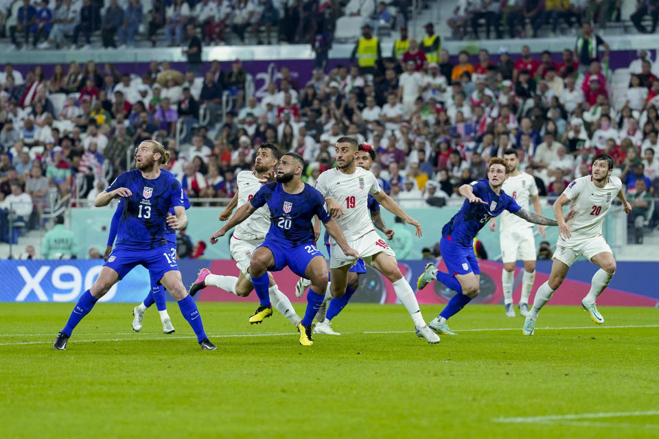 DOHA, QATAR - NOVEMBER 29: Tim Ream of USA, Morteza Pouraliganji of Iran, Cameron Carter-Vickers of USA, Majid Hosseini of Iran, Weston McKennie of USA, Josh Sargent of USA and Sardar Azmoun of Iran look on during the FIFA World Cup Qatar 2022 Group B match between IR Iran and USA at Al Thumama Stadium on November 29, 2022 in Doha, Qatar. (Photo by Mohammad Karamali/DeFodi Images via Getty Images)