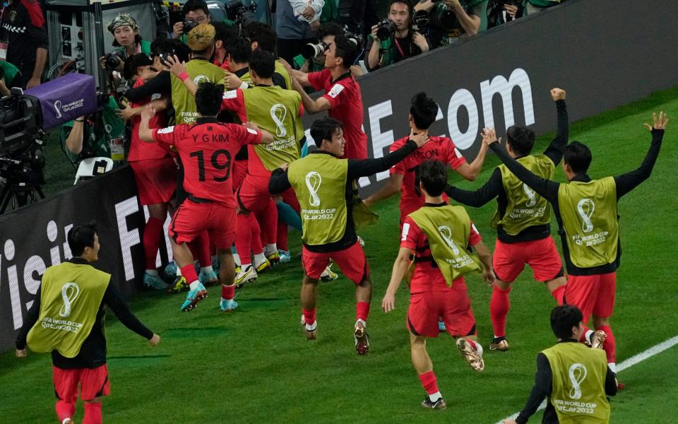 South Korea's team players celebrate after scoring their side's second goal - AP