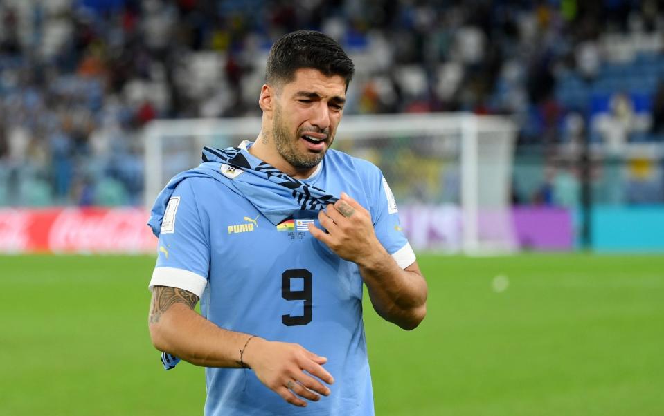 Luis Suarez of Uruguay looks dejected after their sides' elimination - GETTY IMAGES