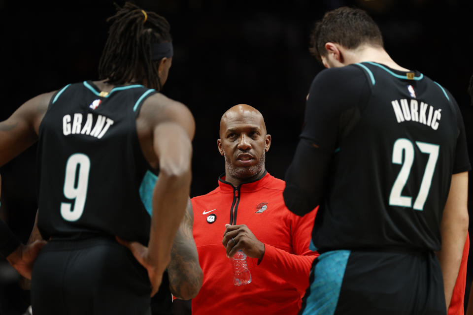 Portland Trail Blazers head coach Chauncey Billups talks with Jerami Grant and Jusuf Nurkic during a game against the Brooklyn Nets on Nov. 17, 2022. (Steph Chambers/Getty Images)