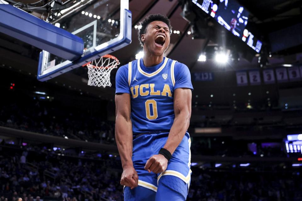 UCLA guard Jaylen Clark reacts after a slam dunk during the second half of an NCAA college basketball game.