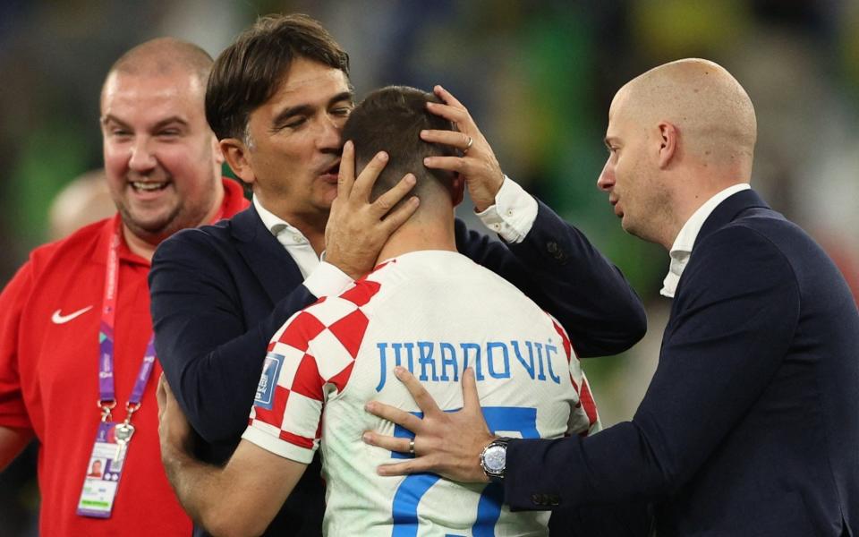 Croatia coach Zlatko Dalic celebrates with defender Josip Juranovic - Adrian Dennis/AFP