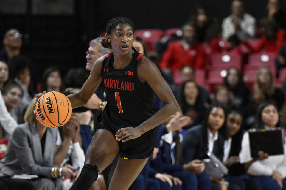 Maryland guard Diamond Miller brings the ball up court during the second half against Connecticut on Dec. 11, 2022, in College Park, Maryland. (AP Photo/Terrance Williams)