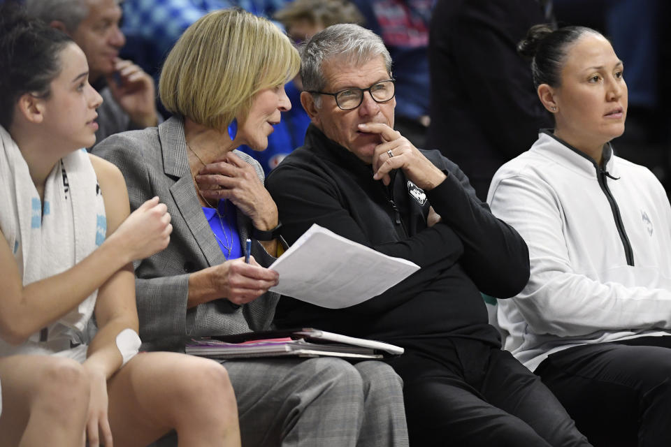 UConn head coach Geno Auriemma talks with associate head coach Chris Dailey, left, during a recent game. Injuries have sidelined multiple UConn players for various amounts of time this season. (AP Photo/Jessica Hill)