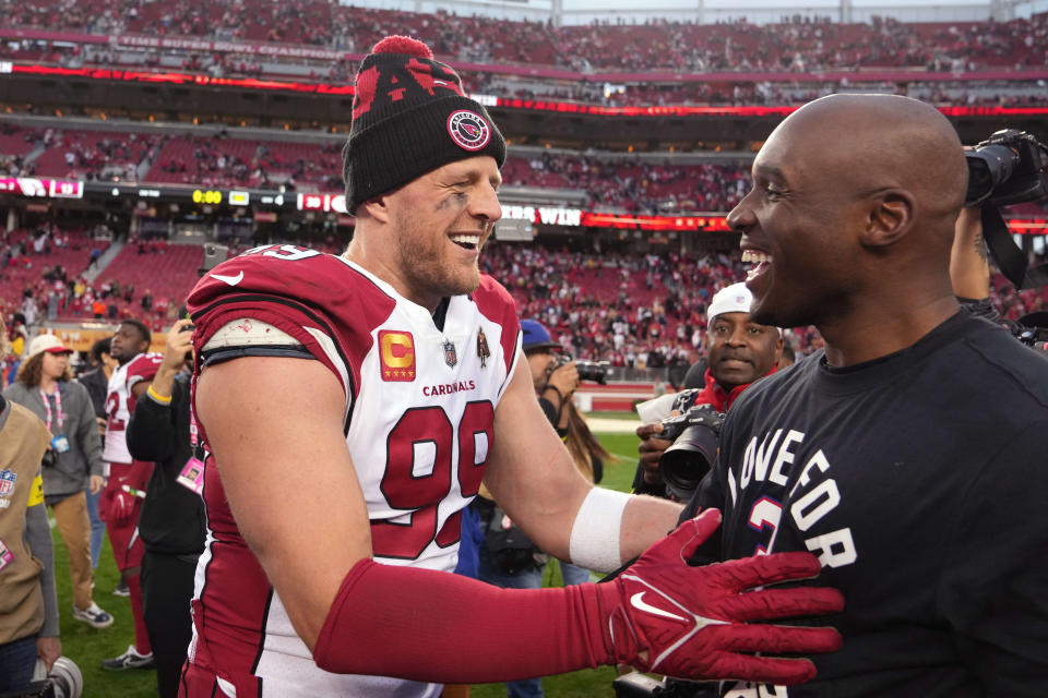 Arizona Cardinals defensive end J.J. Watt (99) talks to San Francisco 49ers defensive coordinator DeMeco Ryans (right) after the game on Sunday, Jan. 8, 2023, at Levi's Stadium. The two were teammates for a year during Watt's rookie season in Houston in 2011.